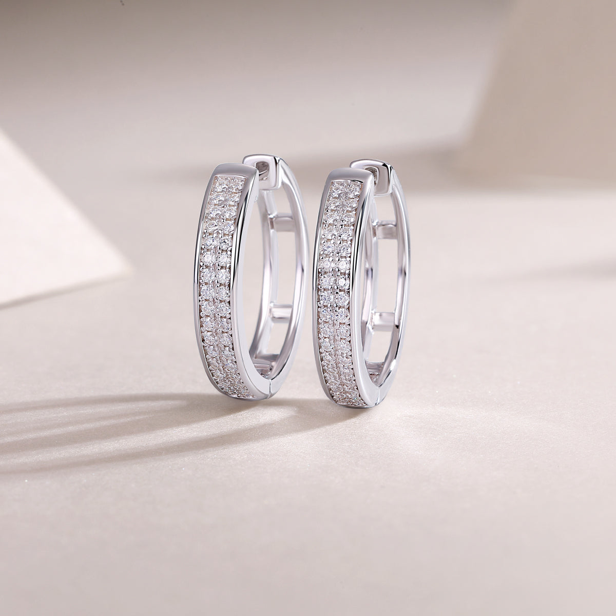 Double-row pavé moissanite hoop earrings in platinum-plated sterling silver