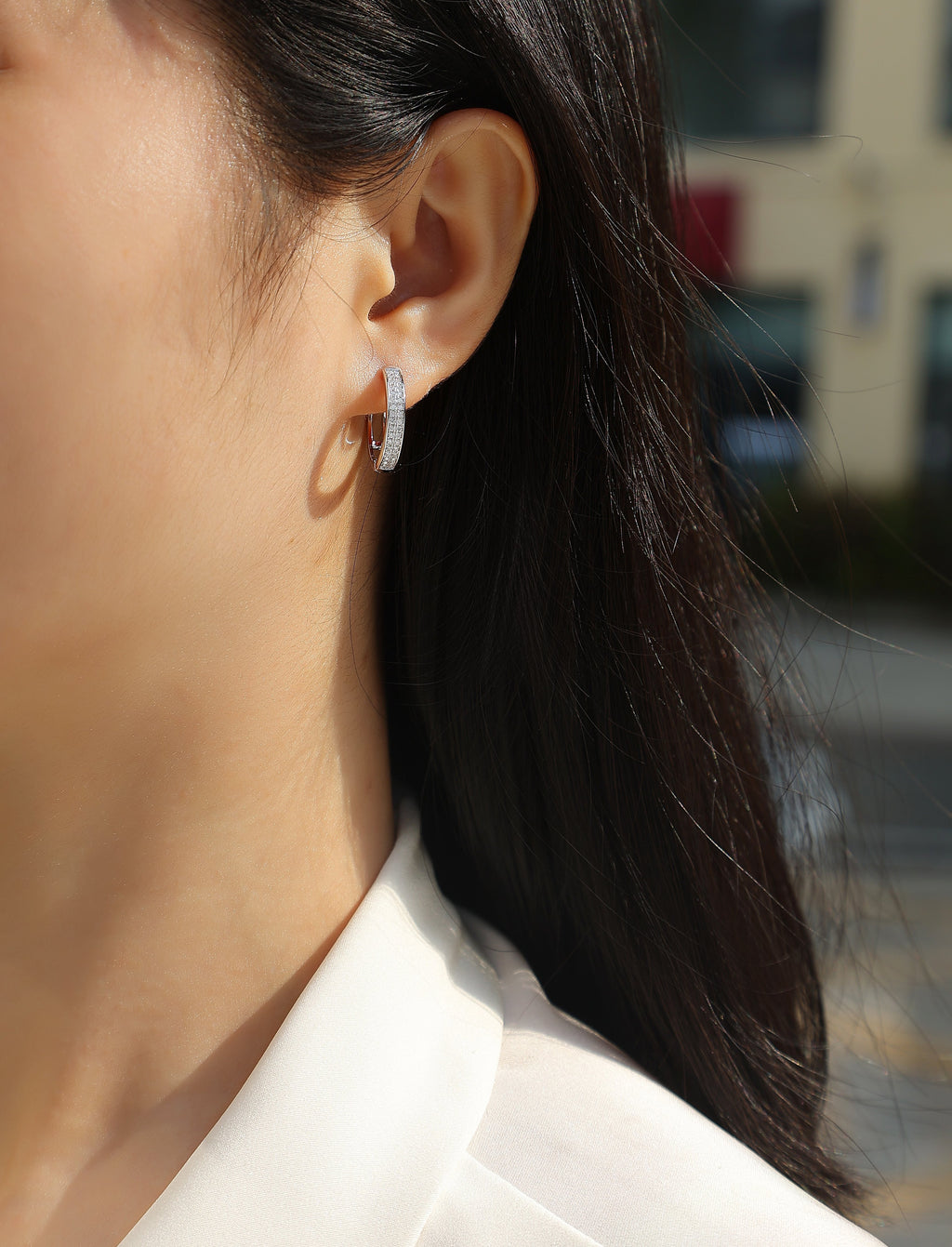 Model wearing a double-row pavé moissanite hoop
