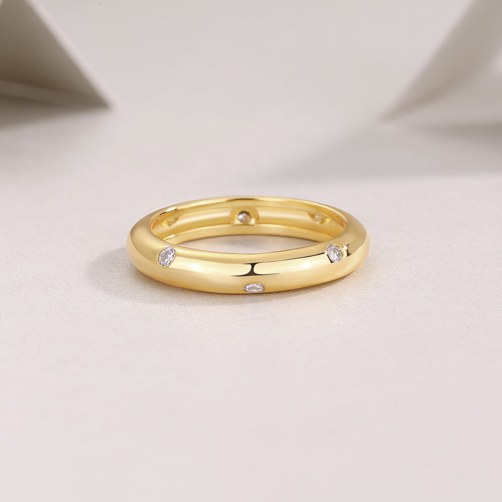 Starry moissanite dome band, gold, close-up