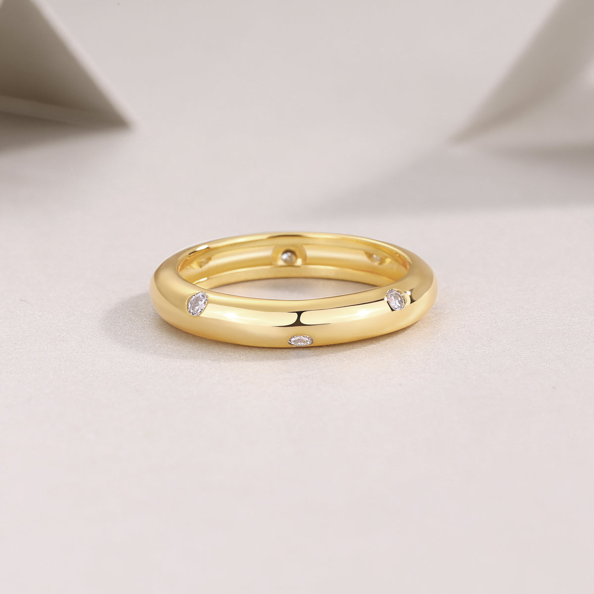 Starry moissanite dome band, gold, close-up