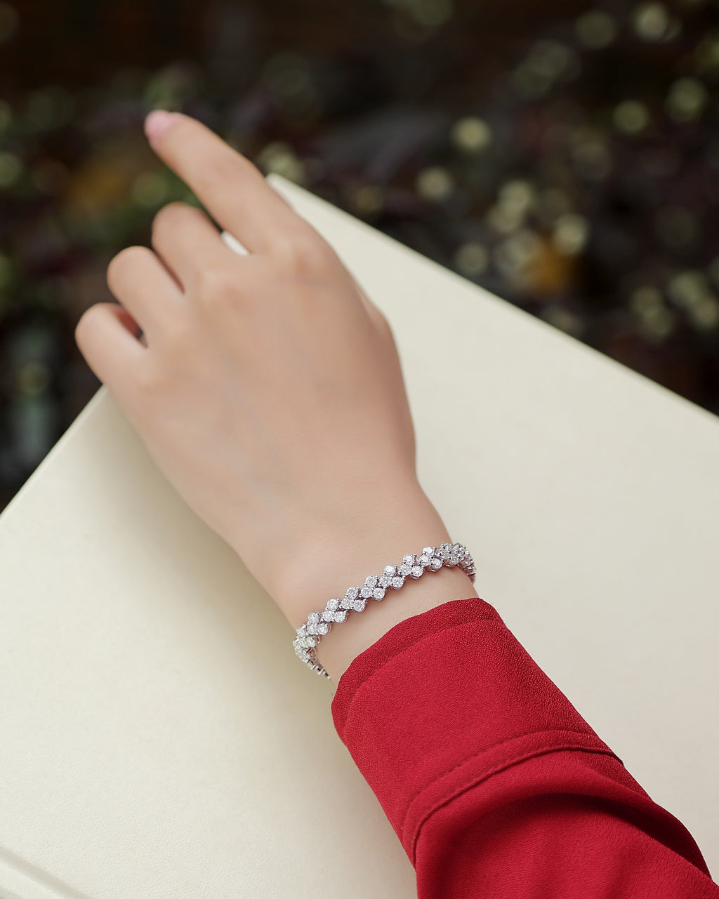Flower-cluster moissanite tennis bracelet, close-up