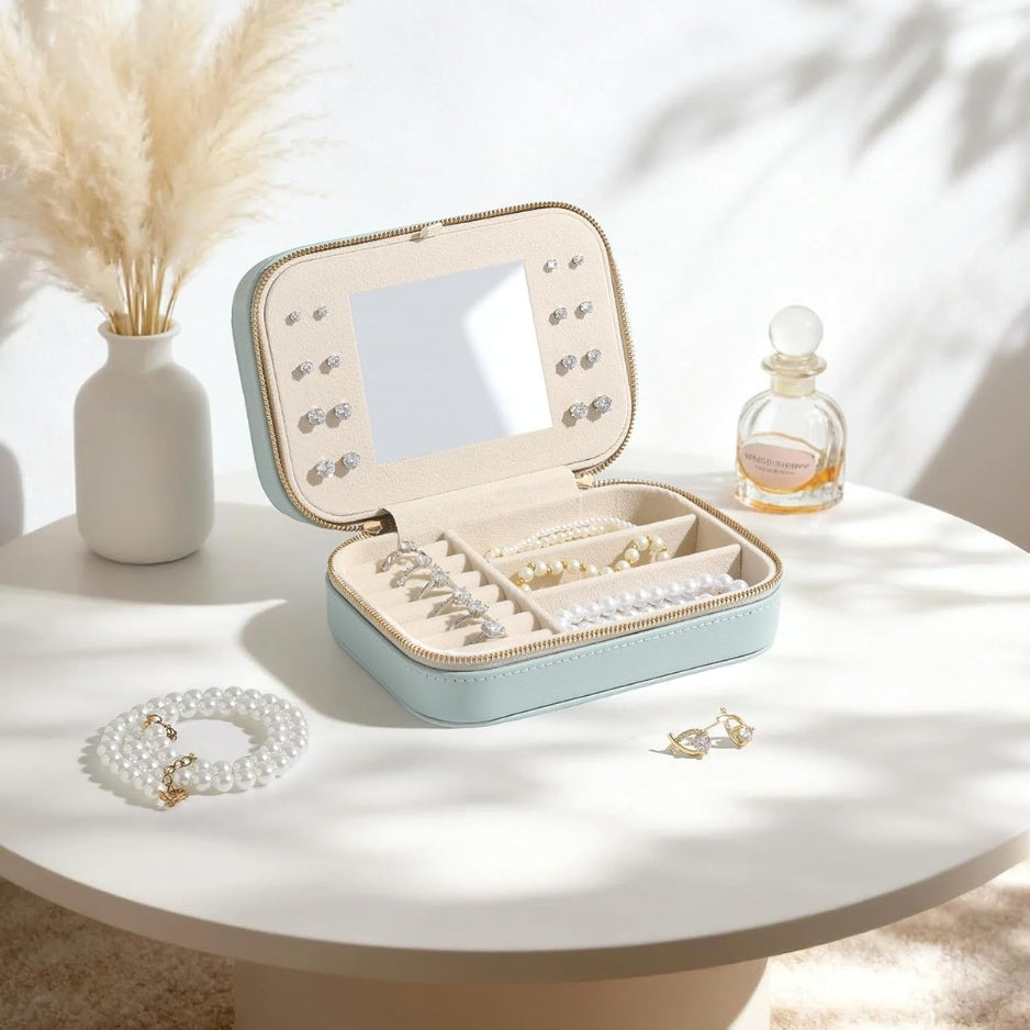 Open travel jewelry case on a side table