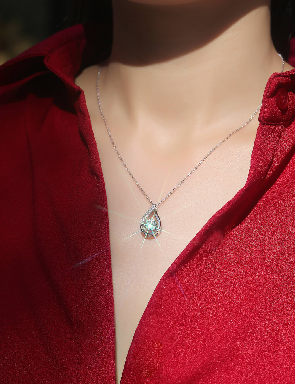 1 carat moissanite teardrop pendant on a sterling silver chain