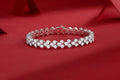 Moissanite tennis bracelet with continuous cluster settings