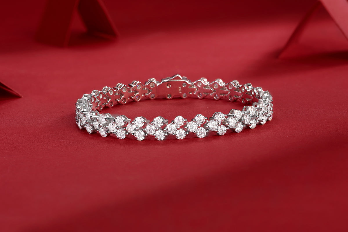 Moissanite tennis bracelet with continuous cluster settings