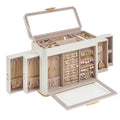Cloud white vertical jewelry armoire with drawers and doors open, filled with jewelry