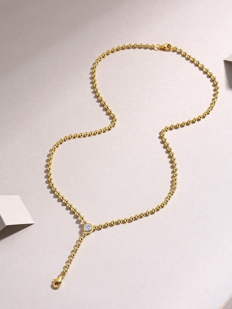 Gold lariat Y necklace with a 0.5 ct moissanite drop