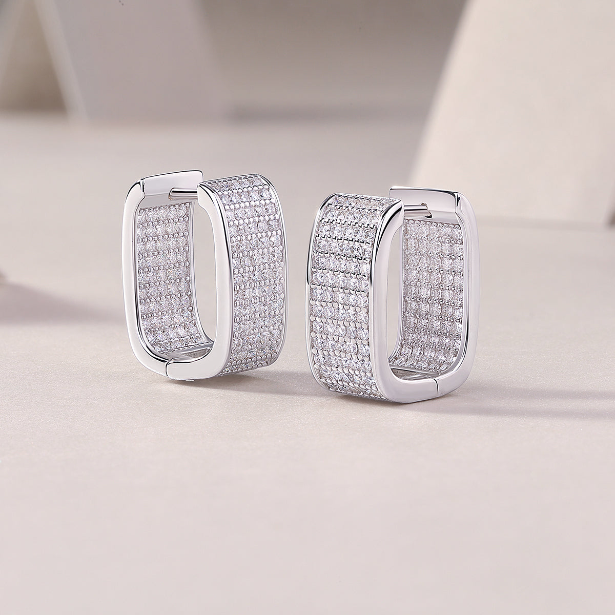 Pavé moissanite huggie earrings, side view