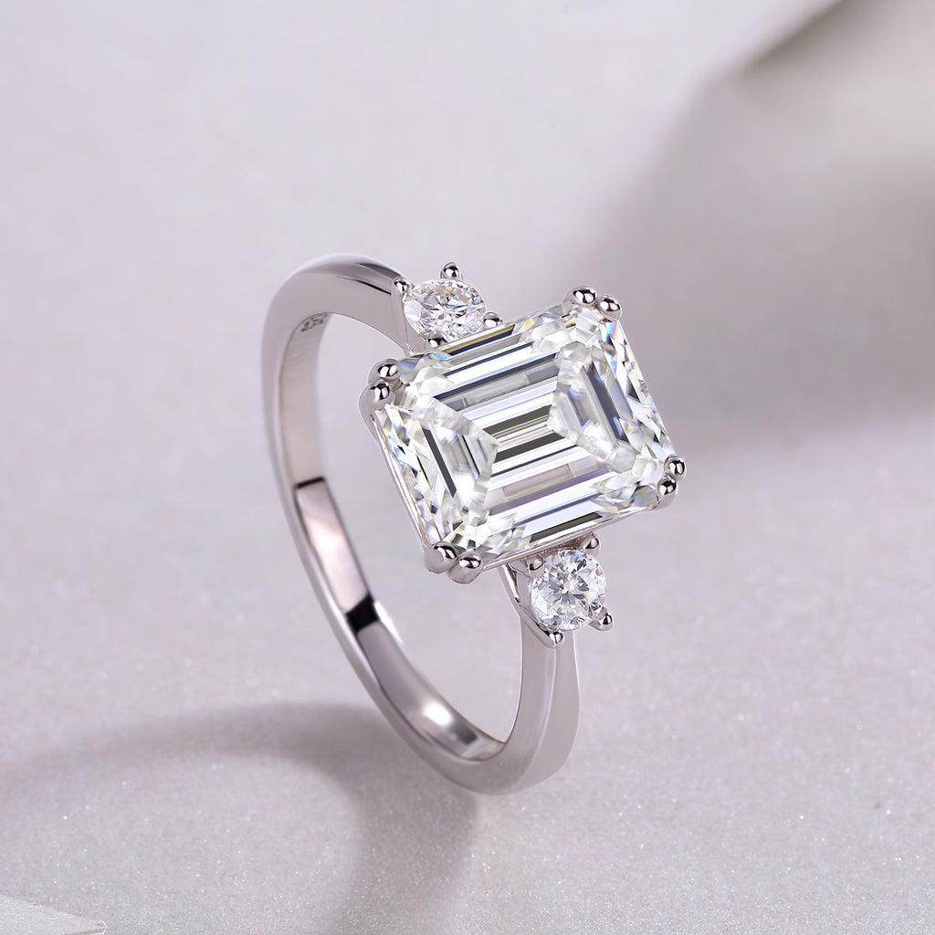 Emerald-cut moissanite three-stone ring in 925 sterling silver