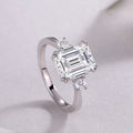 Emerald-cut moissanite three-stone ring in 925 sterling silver