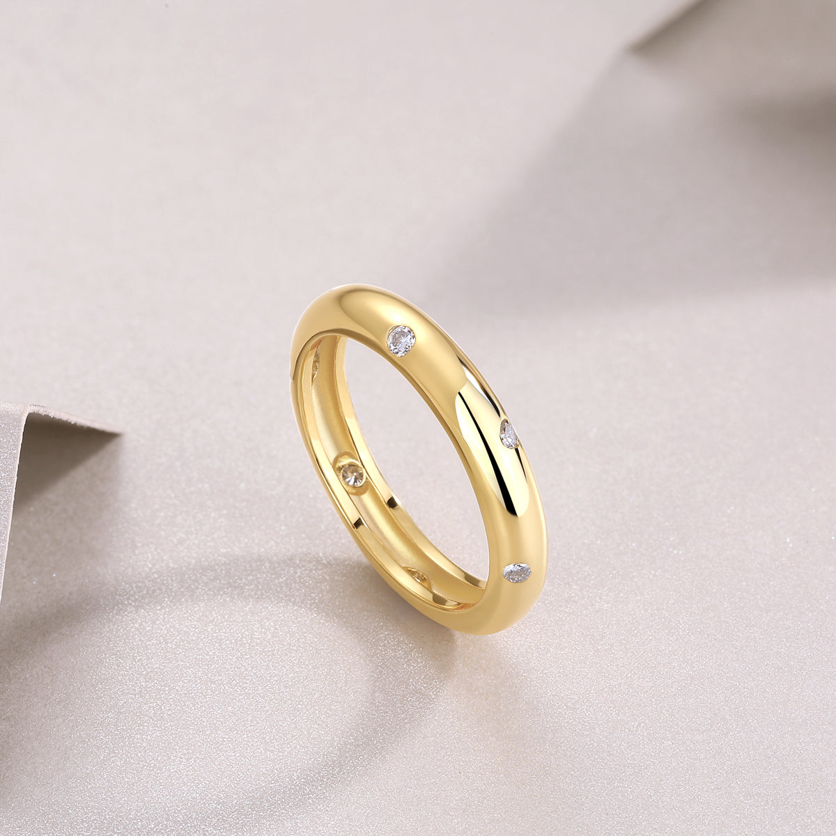Gold dome band with scattered moissanite stars