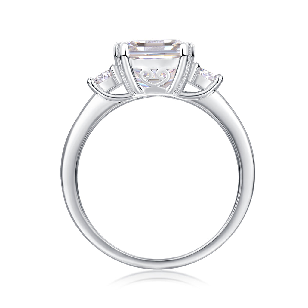Emerald-cut moissanite three-stone ring, profile view