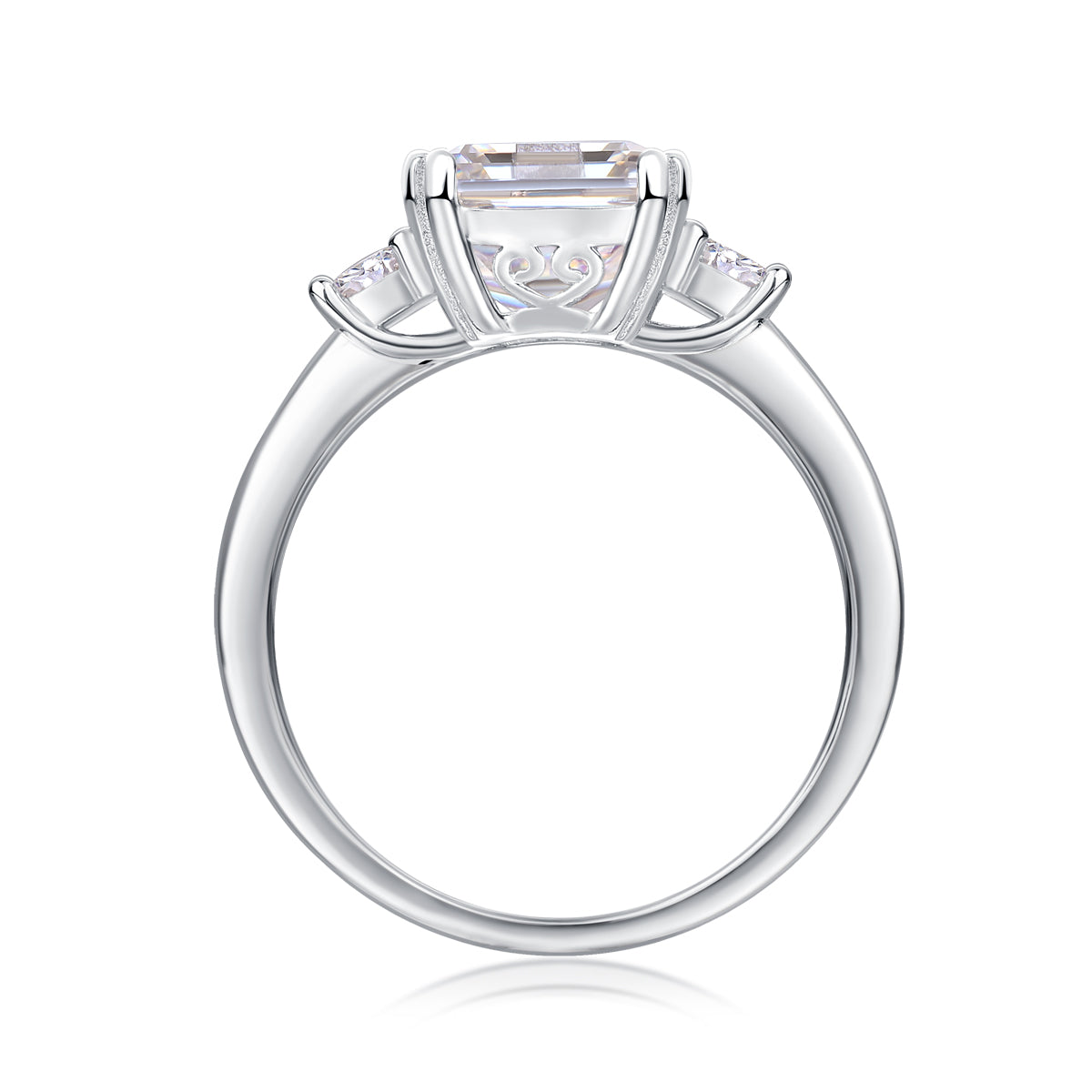 Emerald-cut moissanite three-stone ring, profile view
