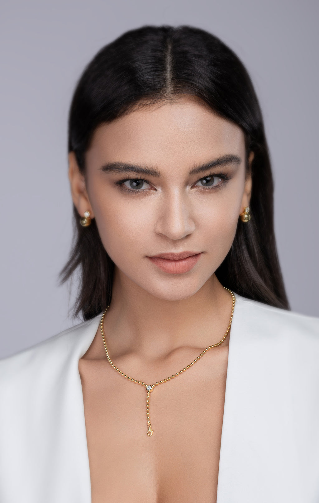 Model wearing the gold moissanite lariat Y necklace