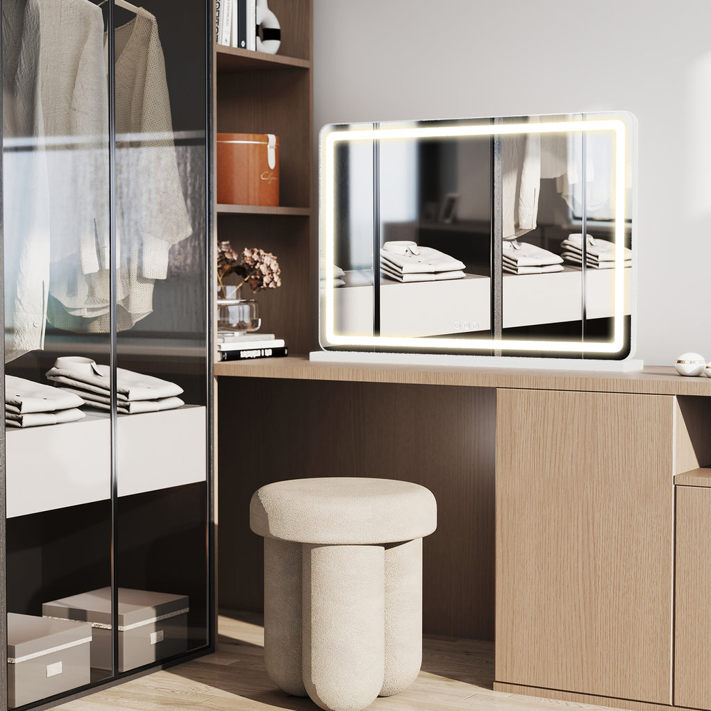Lighted vanity mirror in a bedroom