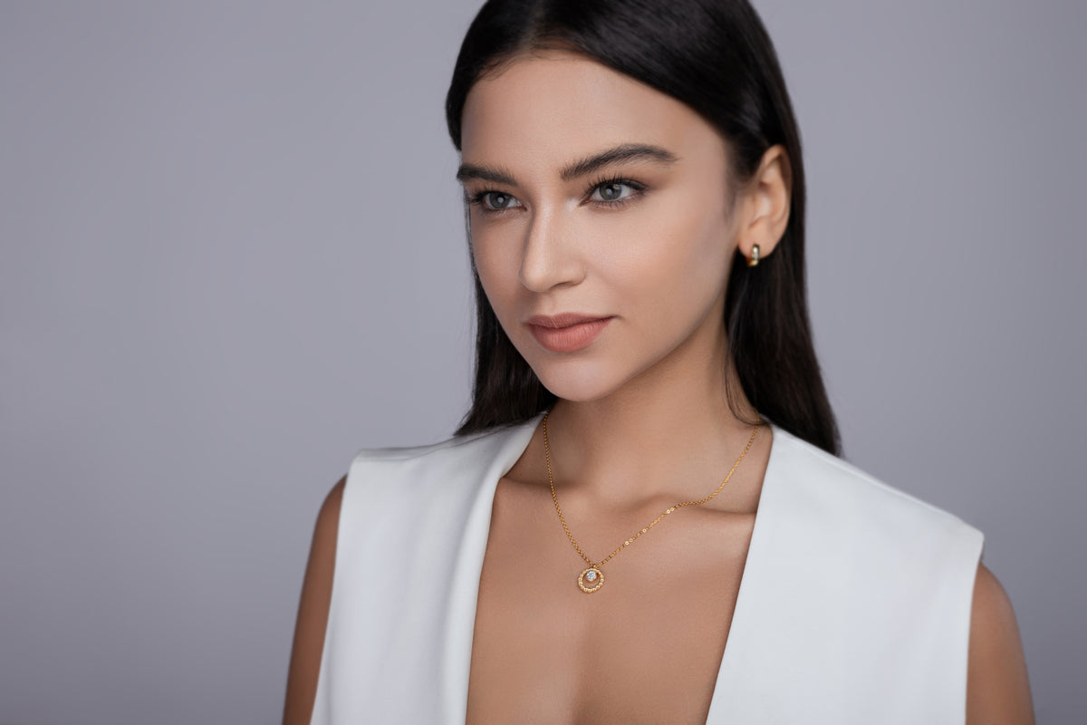 Model wearing the beaded halo pendant necklace