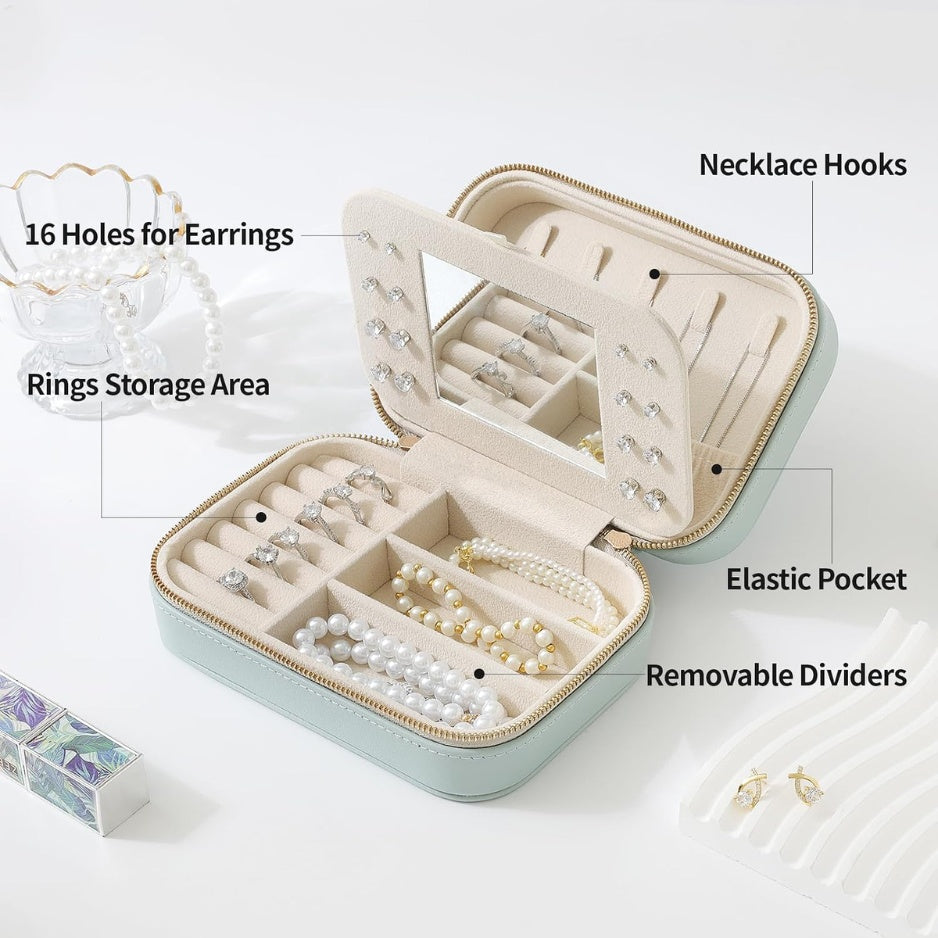 Inside the travel jewelry case: ring rows, earring panel and compartments