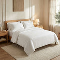 White King sheet set in brushed microfiber on a made hotel-style bed
